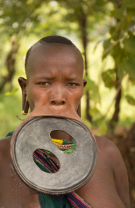 Woman from surma and mursi tribes with a big lip plate