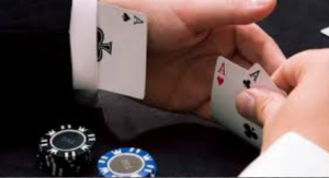 The image shows a person putting a card up their sleeve, and the casino does not allow that