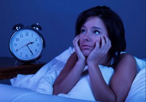 Picture shows a lady who cannot sleep